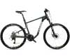 Bicicleta plegable desplegada con cuadro de mountain bike y horquilla de suspensión, diseñada para aventuras al aire libre y viajes